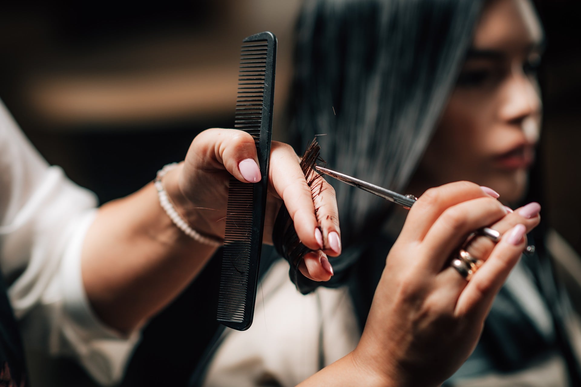 precision haircut with scissors and comb